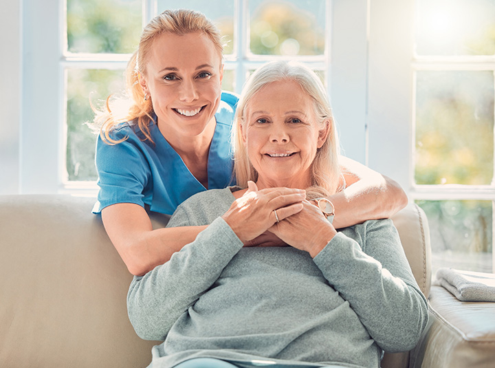 Shot of a female nurse hugging her mature patient